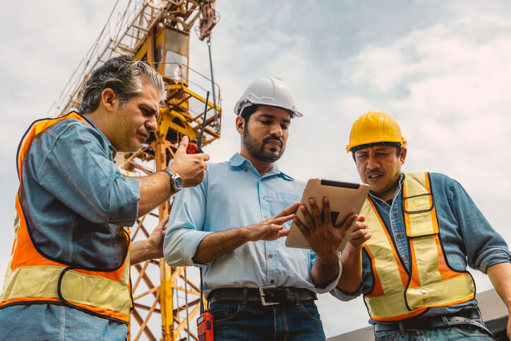 A construction project manager with team in canada